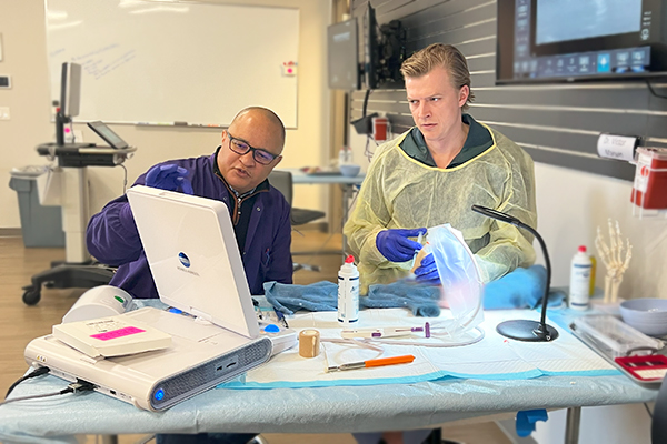 Dr. Darryl Barnes and Dr. Victor Marwin performing carpal tunnel release with ultrasound guidance training